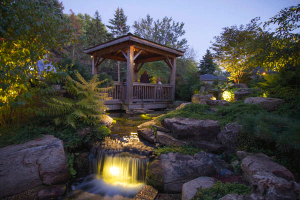 LED backlit waterfall, with surrounding pond lighting and large rock borders, Tapple Hill, North Carolina